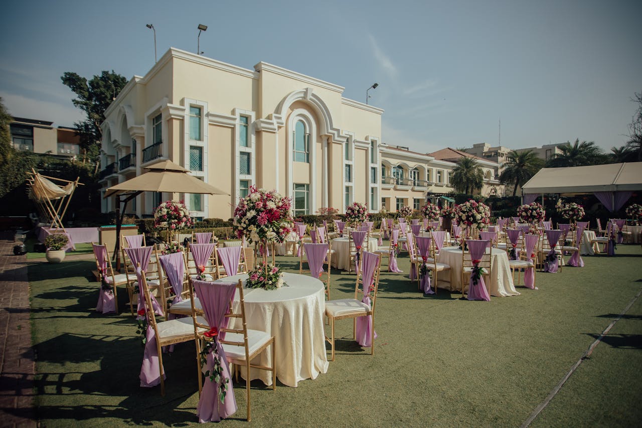 heros-img Stylish outdoor wedding reception with floral decor and seating arrangements.